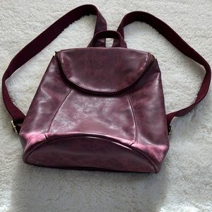 Vegan women’s backpack purse by JOY Susan. In burgundy w brass details